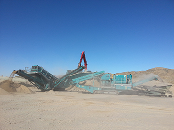 Mobile crushing and screening equipment at a desert project
